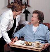 Caregiver serving a meal