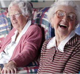 Two smiling elderly women